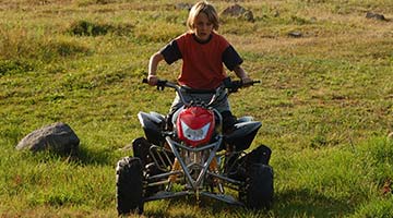 kid riding an ATV